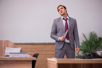 Young businessman employee in bullying concept in the office