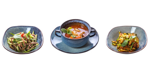 Three dishes: two types of salad and borscht on a white isolated background. The concept of restaurant service. Business lunch.