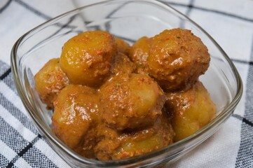 Cilok is balls prepared with a base of tapioca flour. Whether boiled or fried, cilok balls are typically accompanied by a sweet peanut sauce or spicy sauces based on ketchup and kecap manis.