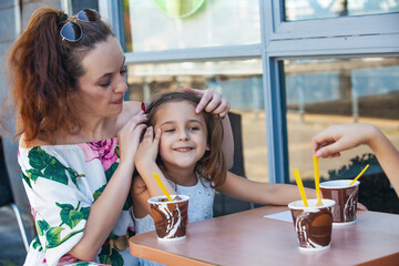 happy family at ice cream cafe