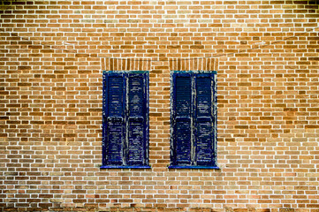 brick wall with blue vintage window