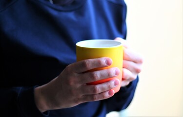 person holding cup of coffee