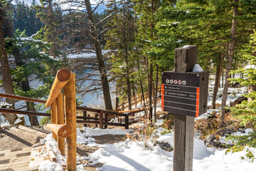 Bow River trail in winter sunny day. Banff National Park, Canadian Rockies. Banff, AB, Canada