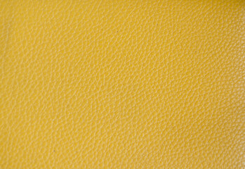 Yellow synthetic leather texture background.