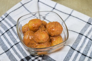 Cilok is balls prepared with a base of tapioca flour. Whether boiled or fried, cilok balls are typically accompanied by a sweet peanut sauce or spicy sauces based on ketchup and kecap manis. 