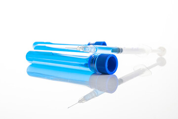 Vaccine vial. Medical syringe with needle for protection flu virus and coronavirus. Covid inoculation on white. Close up vaccine vial dose flu shot drug needle syringe.