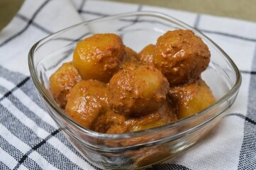 Cilok is balls prepared with a base of tapioca flour. Whether boiled or fried, cilok balls are typically accompanied by a sweet peanut sauce or spicy sauces based on ketchup and kecap manis. 