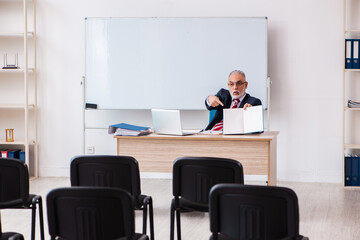 Old male business couch in the classroom during pandemic