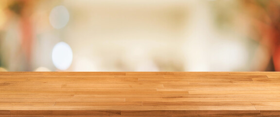 wood table on blurred bokeh light cafe restaurant background