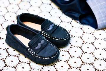 High angle shot of a pair of loafers for children under the light