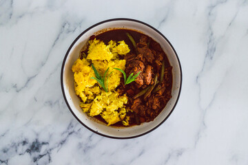 plant-based food, vegan turmeric rice and green beans stew with mock meat