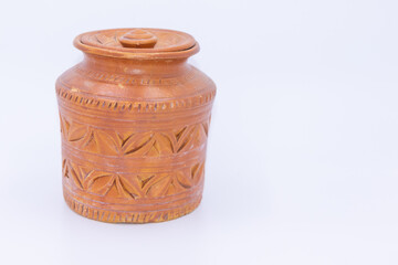 Jar made of clay with designs and patterns on it 