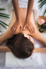woman getting spa body massage treatment at beauty spa salon
