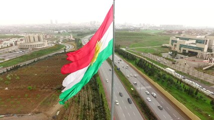 The Flag of Kurdistan, where it was hoisted by thousands of Kurdish rebels. The flag was subsequently presented to the European powers at the Versailles Peace Conference