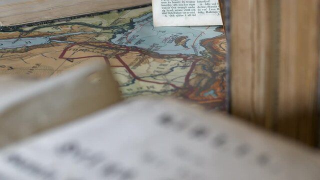 Old Ancient Bible and Map, Tilt, Close Up