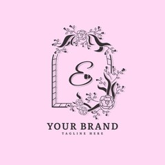 Initial letter E with natural logo vector concept element, letter E logo with floral ornament. Minimalist design logo.