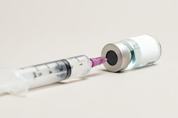 Blank white label on injection bottle glass vial with syringe