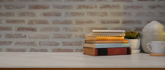 Study table in home office room with books, decorations and copy space on the table © bongkarn