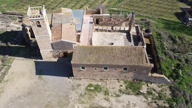 View from drone of ancient ruined monastery of Avinganya near Catalan city of Seros on spring sunny day, Spain