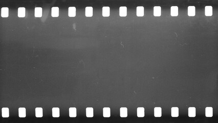 Dusty and grungy 35mm film texture material or surface. Dust particle and grain texture or dirt use for overlay film frame effect with space for vintage grunge design. Clipping patch