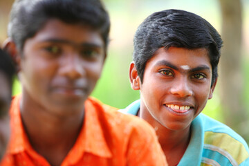 Group of Indian happy teen boys looking at the camera.