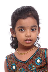 Cute Indian little girl portrait on white.