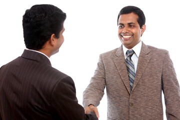 Two Indian business people shaking hands