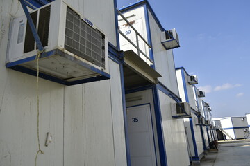 Portacabin, porta cabin, temporary labors camp , Mobile building in industrial site or office container Portable house and office cabins. Labor Camp. Porta cabin. small temporary houses