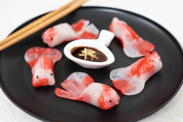 Beautiful steamed crystal dumpling in Koi fish shape, Chinese and Japanese food art