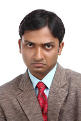 Angry Indian business man on white background.