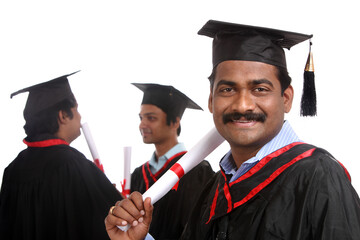 Indian graduates isolated on white background.