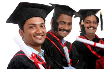 Indian graduates isolated on white background.