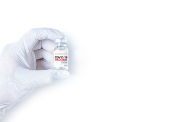 COVID-19 Vaccine concept in hand of scientist white vaccine jar isolated on white background.