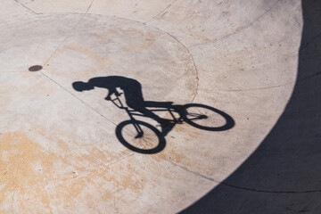 shadow of young man practicing jumping jacks. recreational activities concept