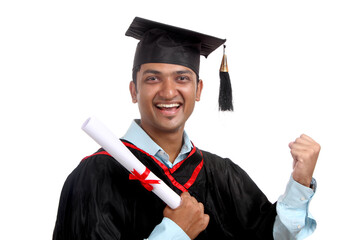 Cheerful Indian graduate isolated on white.