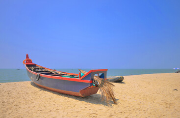 A boat kept on marari beach in Kerala.