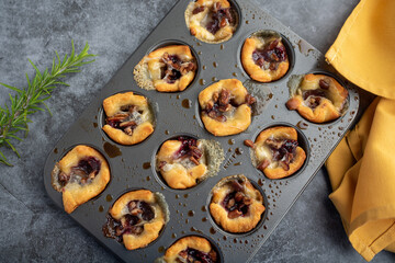 Brie bites with jam and nuts in crescent dough, mini appetizer dessert with cranberry or any jelly
