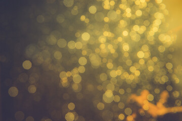 Gold bokeh blur defocus in black backgeound