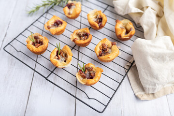 Brie bites with jam and nuts in crescent dough, mini appetizer dessert with cranberry or any jelly