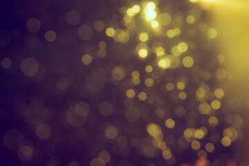 Gold bokeh blur defocus in black backgeound