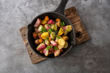 Roasted vegetables mix in a cast iron mini skillet ready to serve