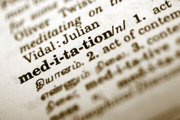 close up of a dictionary and a word