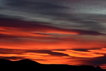 Morning sky over the roofs. Sunrise. Urban landscape. Dawn. Daybreak. Sunset/ Dark beautiful sunset