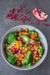 healthy tasty Broccoli salad with pomegranate on a table