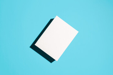 White cardboard box mock up. Top view, blue background. Place for logo, advertising. Delivery concept