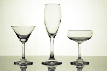 Various types of glasses on white background