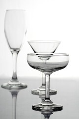 Various types of glasses on white background