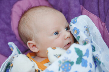 Portrait of a blue-eyednewborn baby