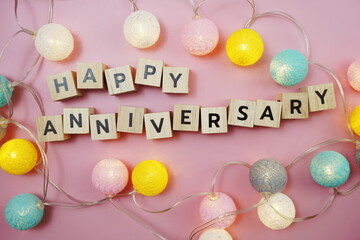 Happy Anniversary alphabet letter with LED cotton balls on pink background
