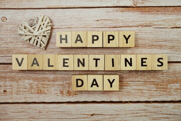 Happy Valentines day alphabet letter on wooden background